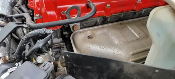 Early supercharger mounting arrangement