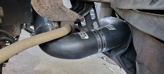 Charge hose routed past the chassis and steering components