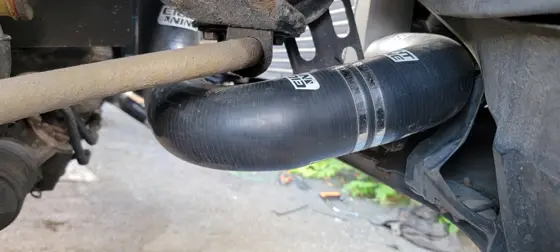 Lower charge-pipe routing